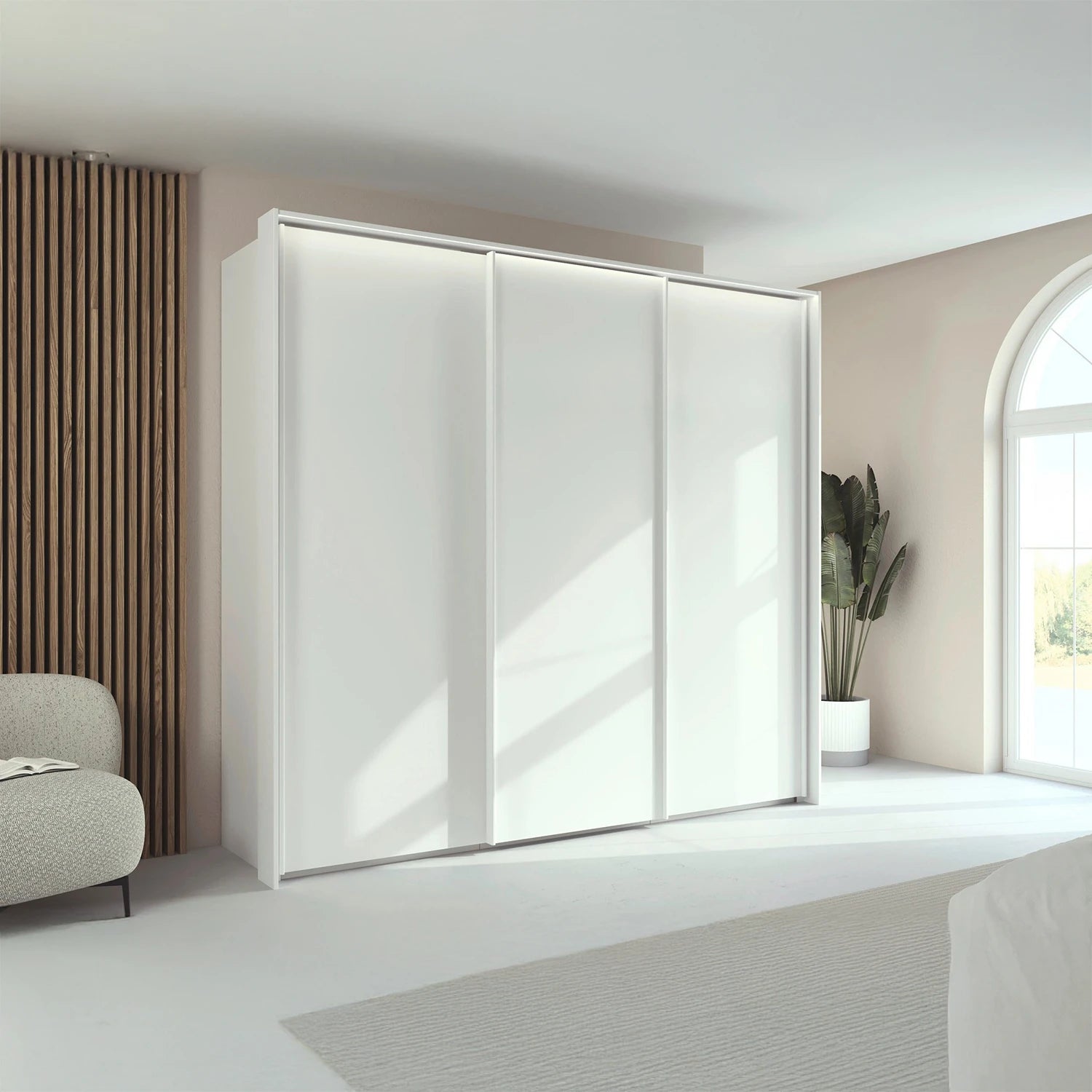 Rauch Taro 3 Door Sliding Wardrobe in Alpine White with passepartout frame styled in a room