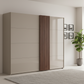 A modern sliding wardrobe with two beige doors and a central vertical slatted panel in a warm brown tone, shown in a minimalist room setting with a gray rug and a potted plant.