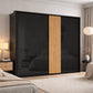 Modern bedroom with a black sliding wardrobe door featuring wooden slats.