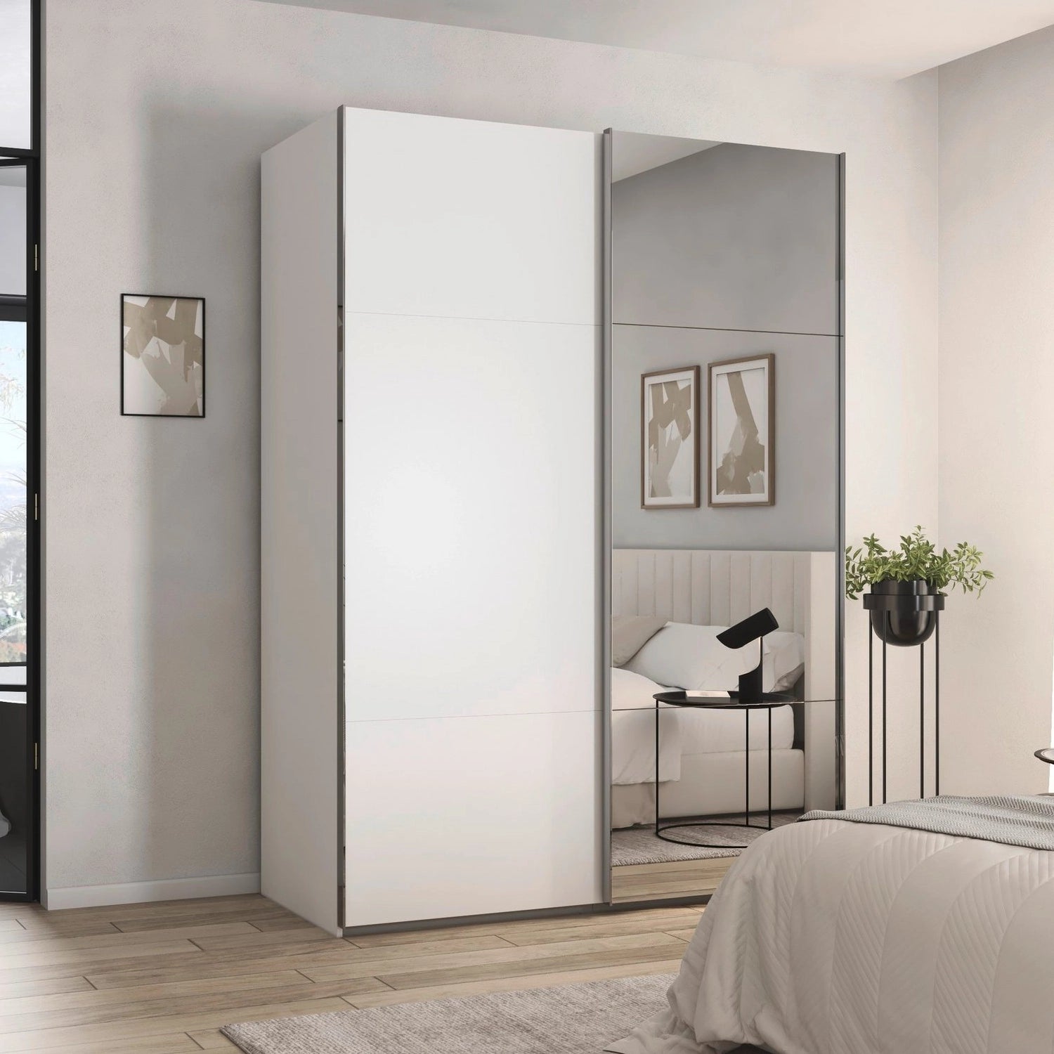 Rauch Contido 2 Door Sliding Wardrobe with Mmirror in White Styled in a Bedroom