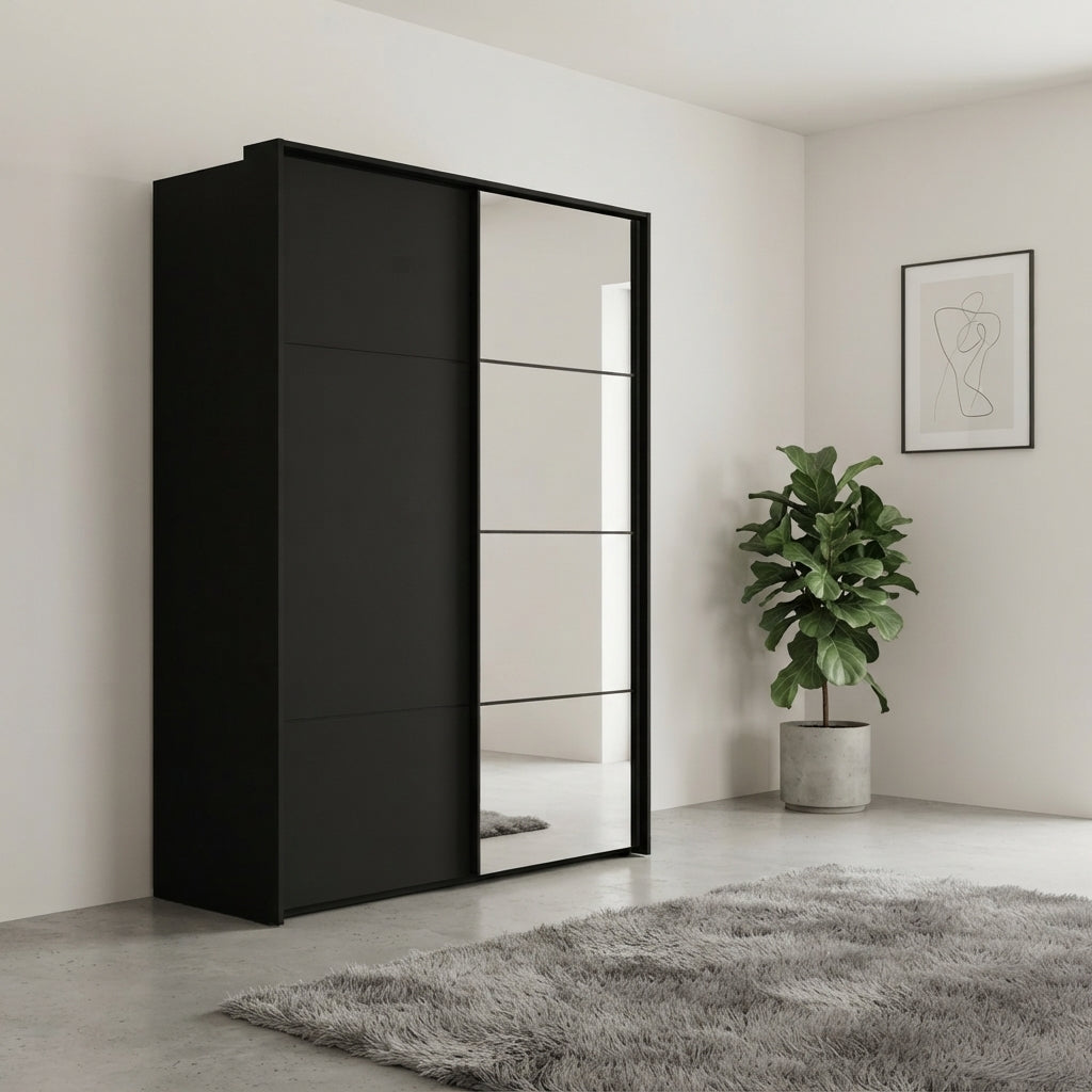 Rauch Heaven 160cm 2 Door Slider Wardrobe with 1 Décor Door and 1 Mirror Door in Black styled in a modern bedroom