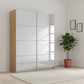 Rauch Impulse Full Mirror 2 Door Sliding Wardrobe in Oak Carcase styled in a modern room