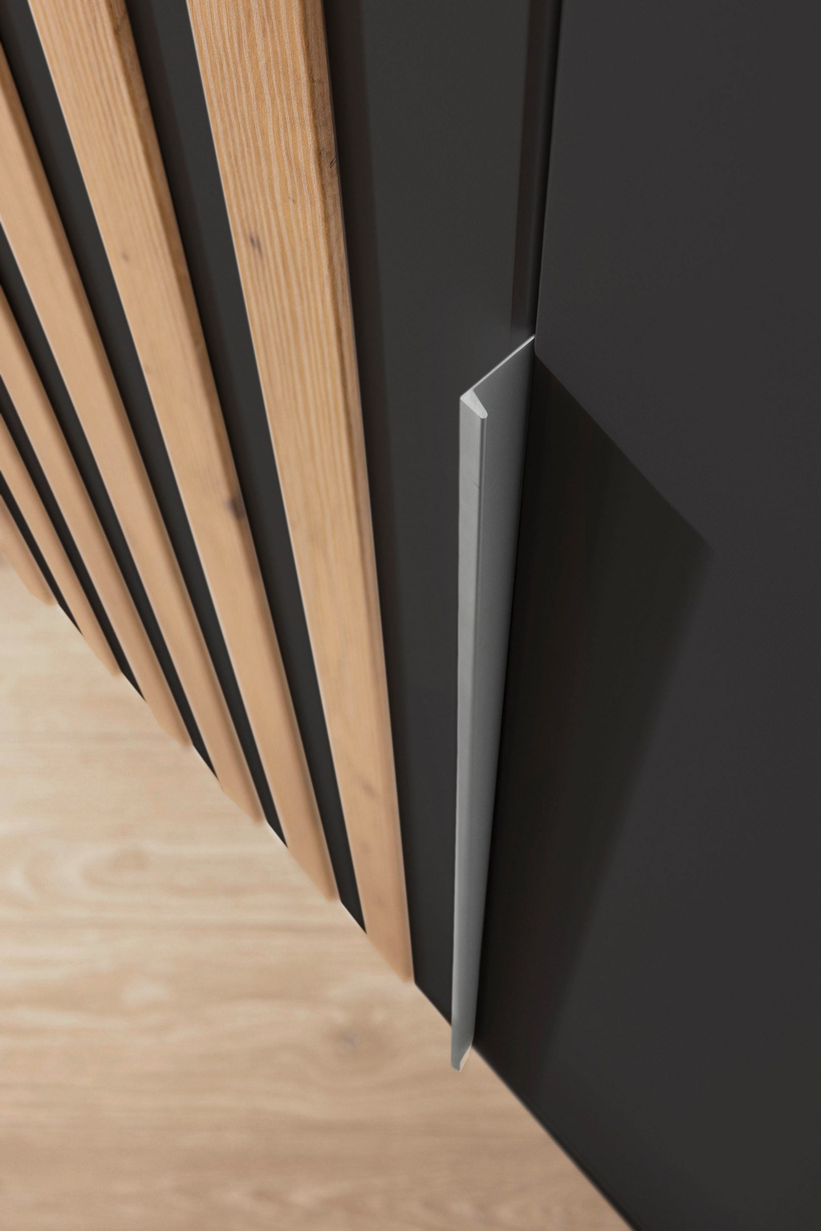 Rauch Lamela 4 door hinged wardrobe door handle closeup view