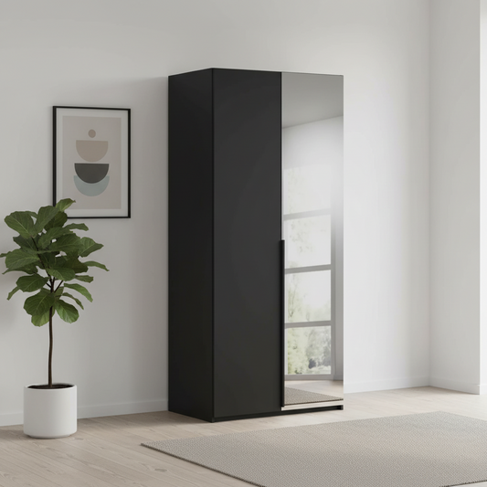 Rauch Heaven 101cm 2 Door Hinged Wardrobe with 1 Décor Door and 1 Mirror Door in Black styled in a modern room