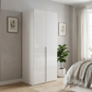 Rauch Heaven 101cm 2 Door Hinged Wardrobe with Glass Doors in White Glass styled in a modern bedroom