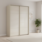 Rauch Heaven 170cm 2 Door Slider Wardrobe with Glass Doors in Champagne styled in a modern bedroom