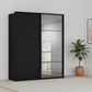 Rauch Heaven 180cm 2 Door Slider Wardrobe with 1 Décor Door and 1 Mirror Door in Black styled in a modern bedroom