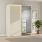 Rauch Heaven 180cm 2 Door Slider Wardrobe with 1 Glass Door & 1 Mirror Door and Lights in Champagne styled in a modern bedroom