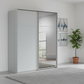 Rauch Heaven 180cm 2 Door Slider Wardrobe with 1 Décor Door and 1 Mirror Door in Silk Grey styled in a modern bedroom