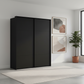 Rauch Heaven 180cm 2 Door Slider Wardrobe with Décor Doors in Black styled in a modern bedroom