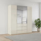 Rauch Haven 4 Door Combi Wardrobe with 2 Glass Doors and 2 Mirror Doors in Champagne styled in a modern bedroom