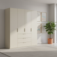 Rauch Heaven 200cm 4 Door Combi Wardrobe with Décor Doors in Champagne styled in a modern bedroom