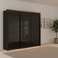 Rauch Heaven 240cm 3 Door Slider Wardrobe with Glass Doors and Lights in Black styled in a modern bedroom
