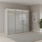 Rauch Heaven 240cm 3 Door Slider Wardrobe with Glass Doors and Lights in Silk Grey styled in a modern bedroom
