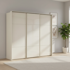 Rauch Heaven 240cm 3 Door Slider Wardrobe with Glass Doors in Champagne styled in a modern bedroom