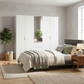 Rauch Haven 5 Door Combi Décor Wardrobe with 4 Décor Doors and 1 Mirror Door - Styled in a Bedroom