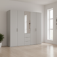 Rauch Heaven 250cm 5 Door Combi Décor Wardrobe with 4 Décor Doors and 1 Mirror Door in Silk Grey styled in a modern bedroom