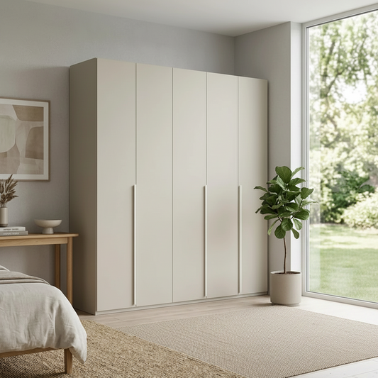 Rauch Heaven 251cm 5 Door Hinged Wardrobe with Décor Doors in Champagne styled in a modern bedroom
