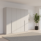 Rauch Heaven 251cm 5 Door Hinged Wardrobe with Décor Doors in Silk Grey styled in a modern bedroom