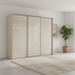Rauch Heaven 270cm 3 Door Slider Wardrobe with Glass Doors in Champagne styled in a modern bedroom
