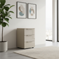Rauch Heaven 3 Drawer Bedside Cabinet with Glass Front in Fango styled in a modern room