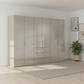 Rauch Heaven 300cm 6 Door Combi Wardrobe with Glass Doors in Fango styled in a modern bedroom
