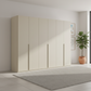 Rauch Heaven 300cm 6 Door Hinged Wardrobe with Décor Doors in Champagne styled in a modern bedroom