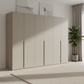 Rauch Heaven 300cm 6 Door Hinged Wardrobe with Décor Doors in Fango styled in a modern bedroom