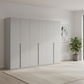 Rauch Heaven 300cm 6 Door Hinged Wardrobe with Décor Doors in Silk Grey styled in a modern bedroom
