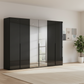 Rauch Heaven 300cm 6 Door Hinged Wardrobe with 4 Glass Doors and 2 Mirror Doors in Black styled in a modern bedroom