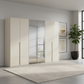 Rauch Heaven 300cm 6 Door Hinged Wardrobe with 4 Glass Doors and 2 Mirror Doors in Champagne styled in a modern bedroom