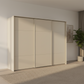Rauch Heaven 300cm 3 Door Slider Wardrobe with Décor Doors in Champagne styled in a modern bedroom