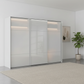 Rauch Heaven 300cm 3 Door Slider Wardrobe with Glass Doors and Lights in Silk Grey styled in a modern bedroom 