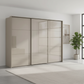 Rauch Heaven 300cm 3 Door Slider Wardrobe with Glass Doors in Fango styled in a modern bedroom
