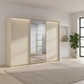 Rauch Heaven 300cm 3 Door Slider Wardrobe with 2 Décor Doors, 1 Mirror Door and Lights in Champagne styled in a modern bedroom