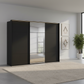 Rauch Heaven 300cm 3 Door Slider Wardrobe with 2 Décor Doors, 1 Mirror Door and Lights in Black styled in a modern bedroom