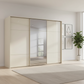 Rauch Heaven 300cm 3 Door Slider Wardrobe with 2 Glass Doors and 1 Mirror Door in Champagne styled in a modern bedroom