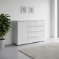 Rauch Heaven 4 Drawer 1 Door Glass Chest with Glass Top and Front in Silk Grey styled in a modern room