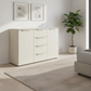 Rauch Heaven 4 Drawer 2 Door Décor Chest in Champagne styled in a modern room