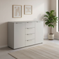 Rauch Heaven 4 Drawer 2 Door Décor Chest in Silk Grey styled in a modern room