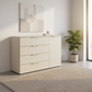 Rauch Heaven 4 Drawer 1 Door Décor Chest in Champagne styled in a modern room