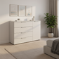 Rauch Heaven 4 Drawer 1 Door Décor Chest in Silk Grey styled in a modern room