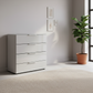 Rauch Heaven 80cm 4 Drawer Chest with Glass Top and Front in Silk Grey styled in a modern room