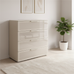 Rauch Heaven 80cm 4 Drawer Chest with Glass Front in Champagne styled in a modern room