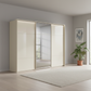Rauch Heaven 300cm 3 Door Slider Wardrobe with 2 Glass Doors, 1 Mirror Door & Lights in Champagne styled in a modern bedroom