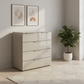 Rauch Heaven 3+2 Drawer Chest with Glass Top and Front in Fango styled in a modern room