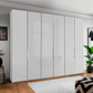 Templin 1000 6 Door Hinged Wardrobe in White Carcase & White Glass Front - Styled in a Bedroom