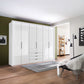 Templin 2000 White Glass 6 Door 3 Drawers 225cm Bifold Wardrobe - Styled in a Room