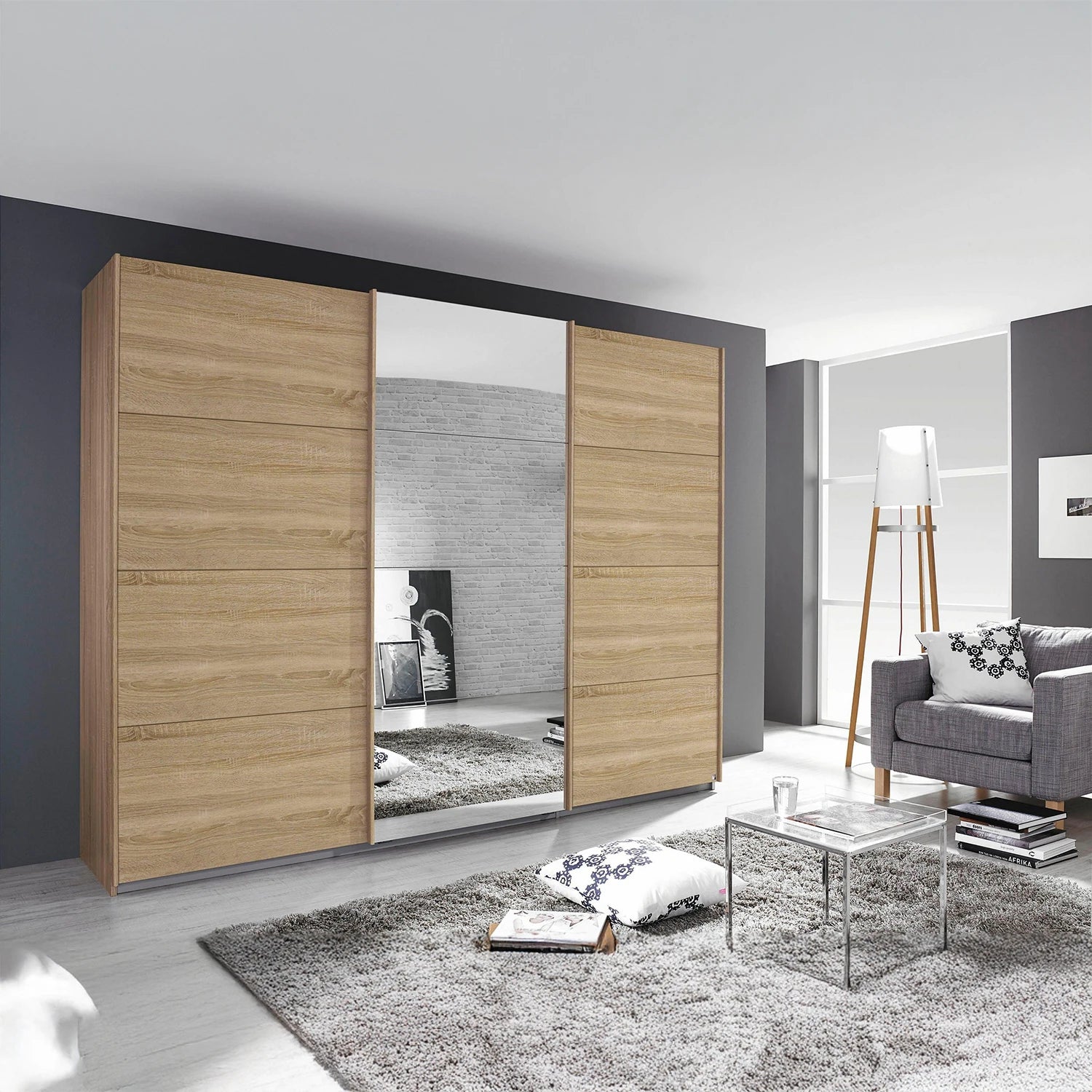 Large 3 Door sliding wardrobe in Sonoma Oak with Middle Door in Mirror by Rauch