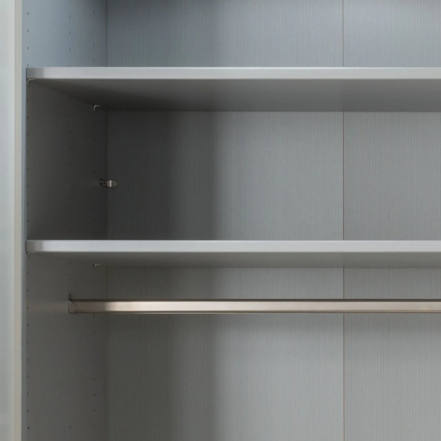 Tulsa Large 3 Door Wardrobe with Mirror and Decking Door - Close Up of Standard Interior of 2 shelves and 1 hanging rail 